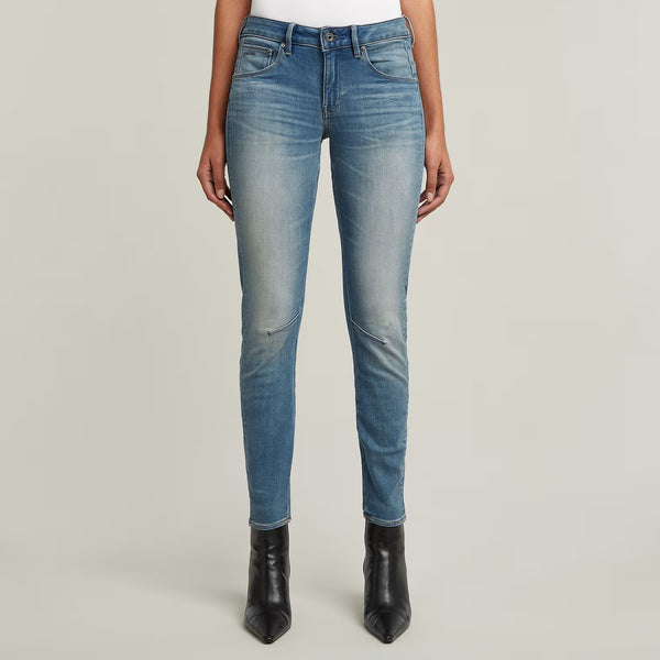 Front view of blue skinny jeans featuring a faded design and slim fit.