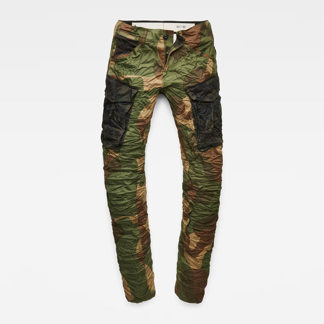 Detail view of the flat front of the green tapered pants with cargo pockets.