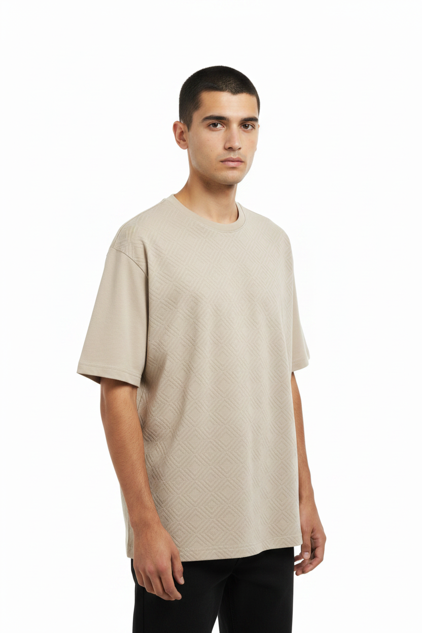Man wearing beige oversized t-shirt