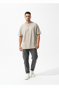 Man wearing beige oversized tee