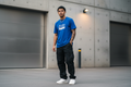 Man wearing Kinetics blue t-shirt