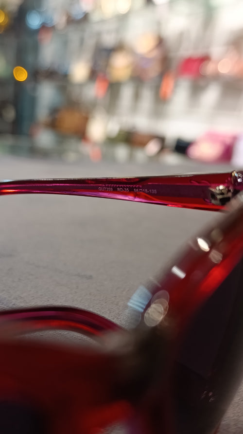 GUESS Women’s Translucent Red Cat-Eye Sunglasses