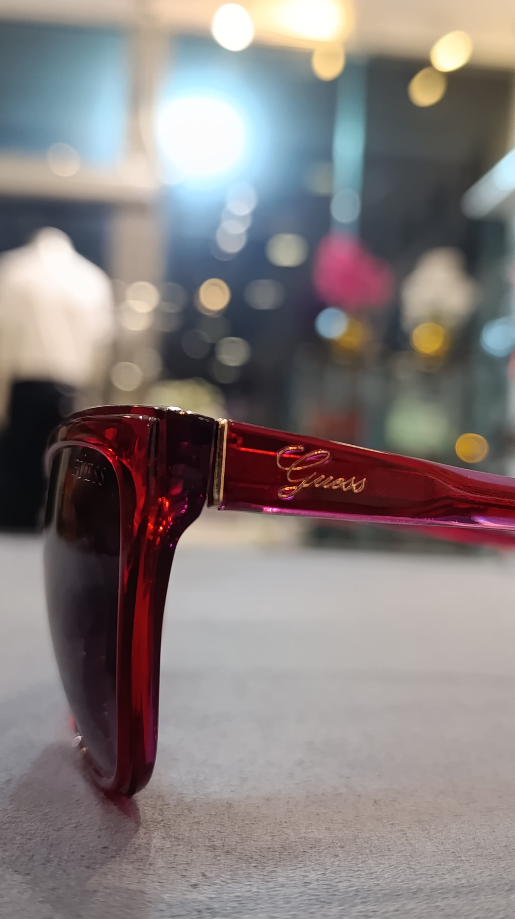 GUESS Women’s Translucent Red Cat-Eye Sunglasses