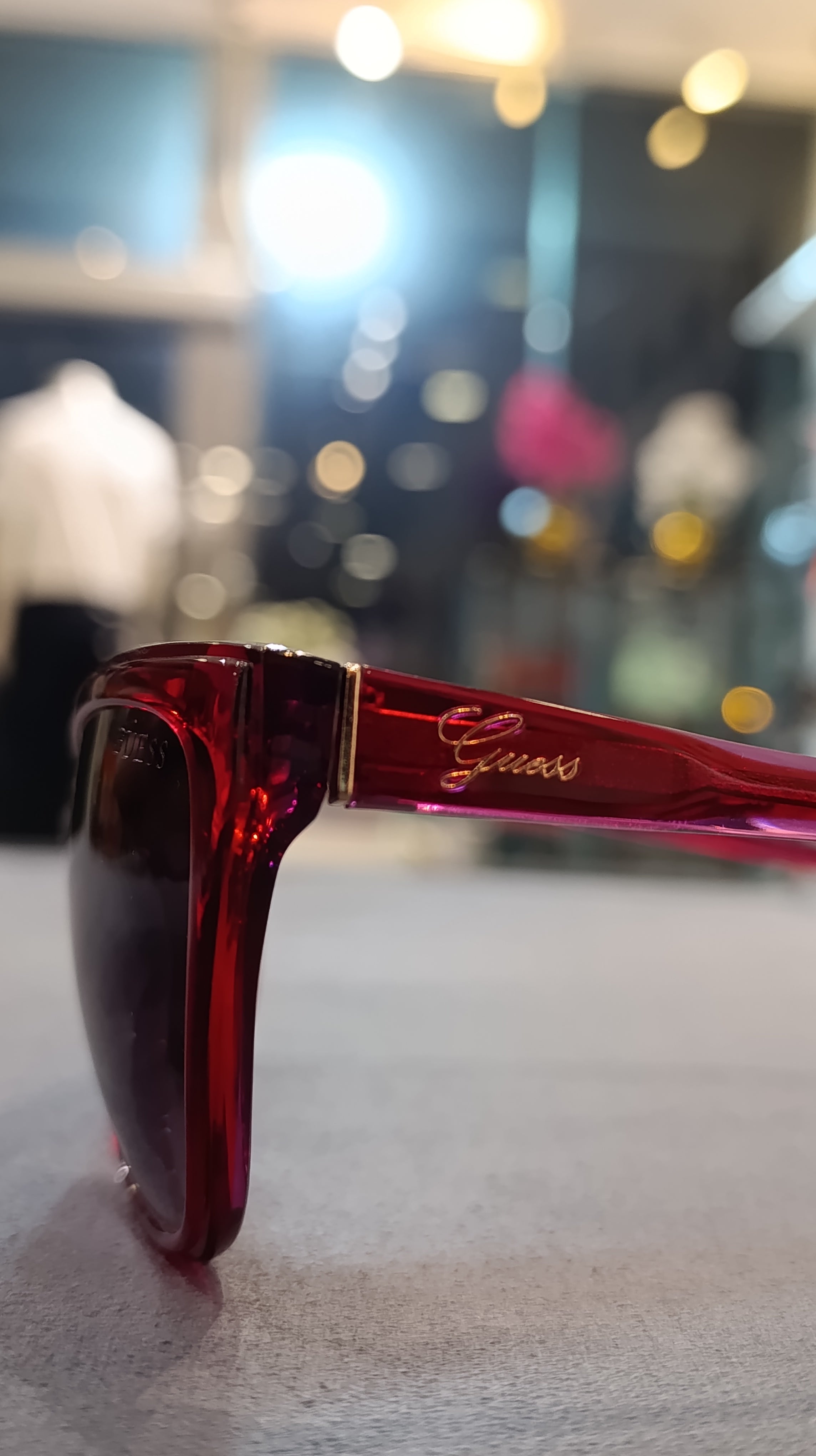 GUESS Women’s Translucent Red Cat-Eye Sunglasses