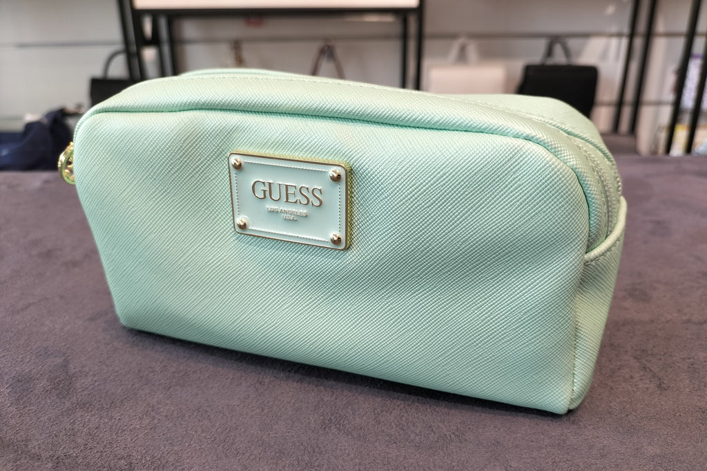 GUESS cosmetic bag featuring a metallic logo plaque and double zippers. PWBAHIP0273 - MNT