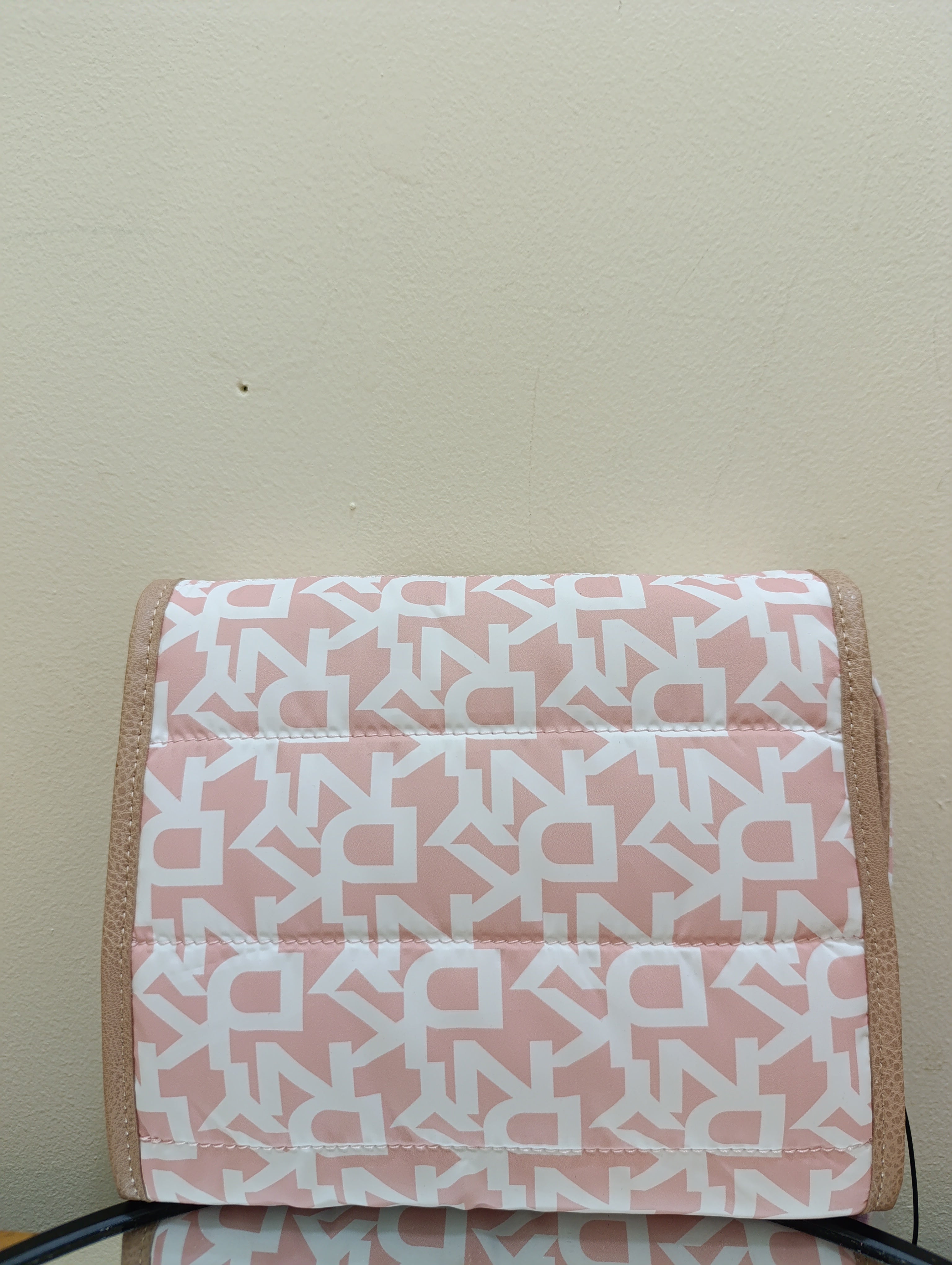 DKNY puffer roll cosmetic bag with a monogram print and tan -White light toffee