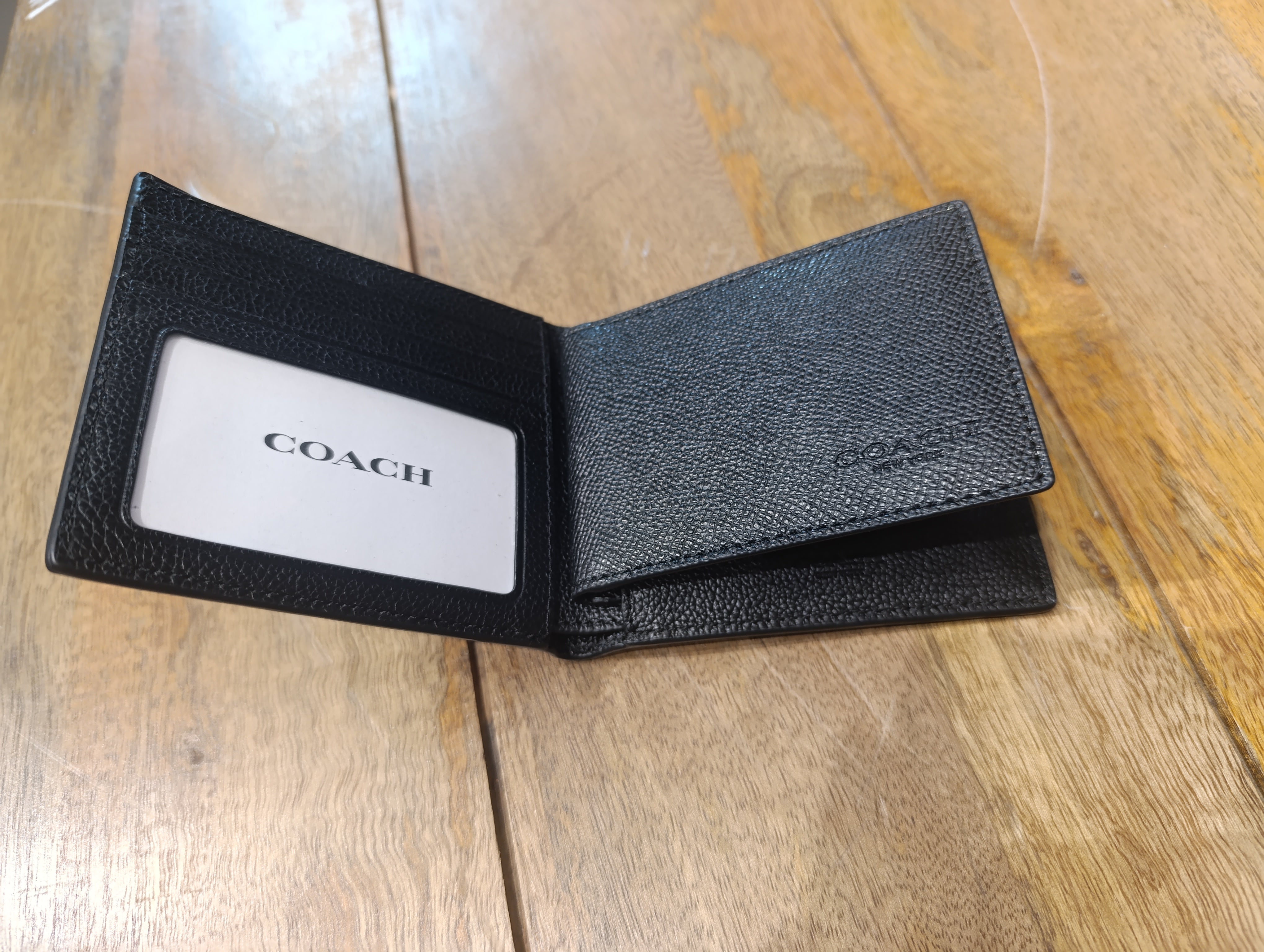 Coach small bifold wallet made of black leather