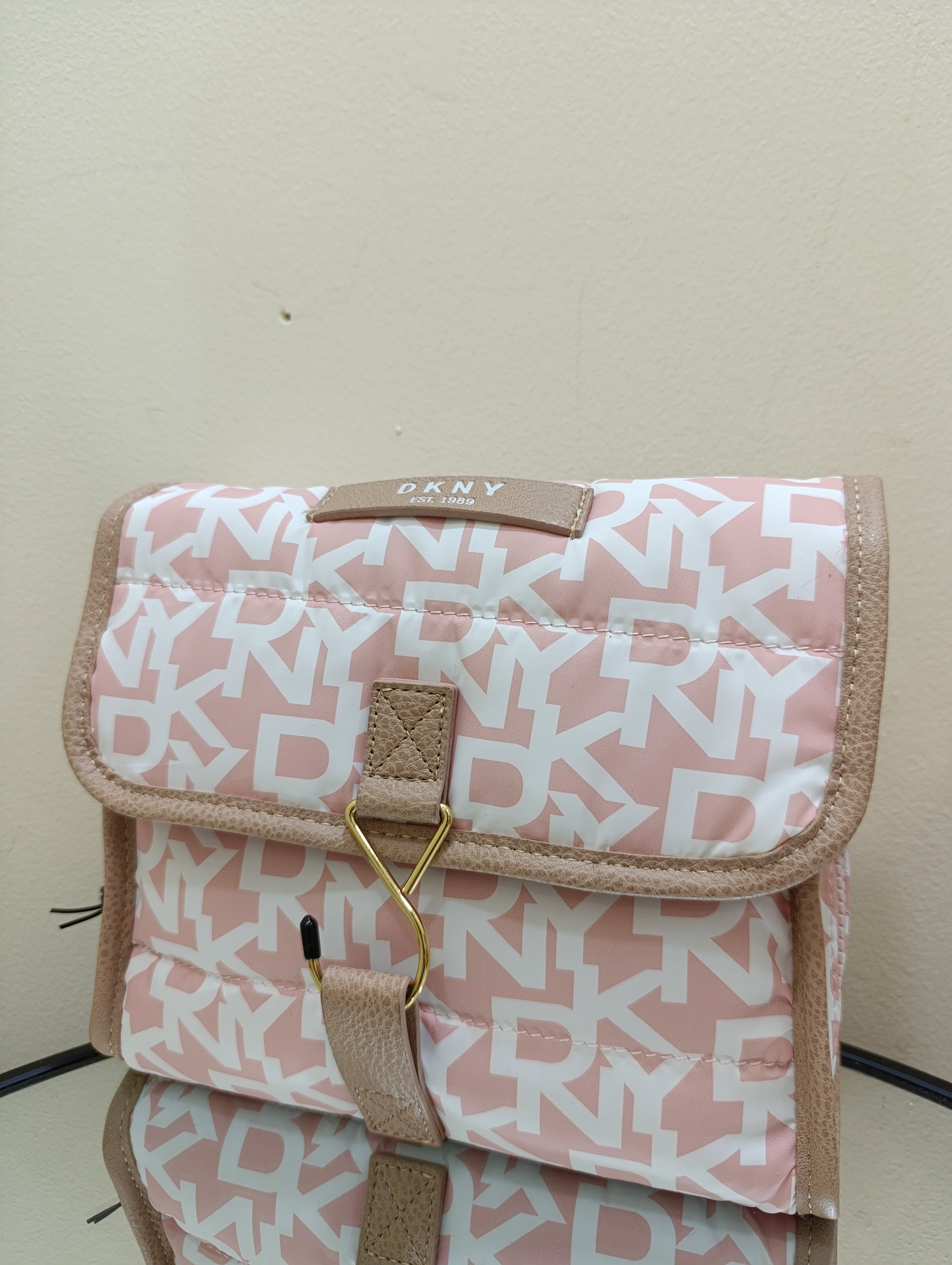 DKNY puffer roll cosmetic bag with a monogram print and tan -White light toffee