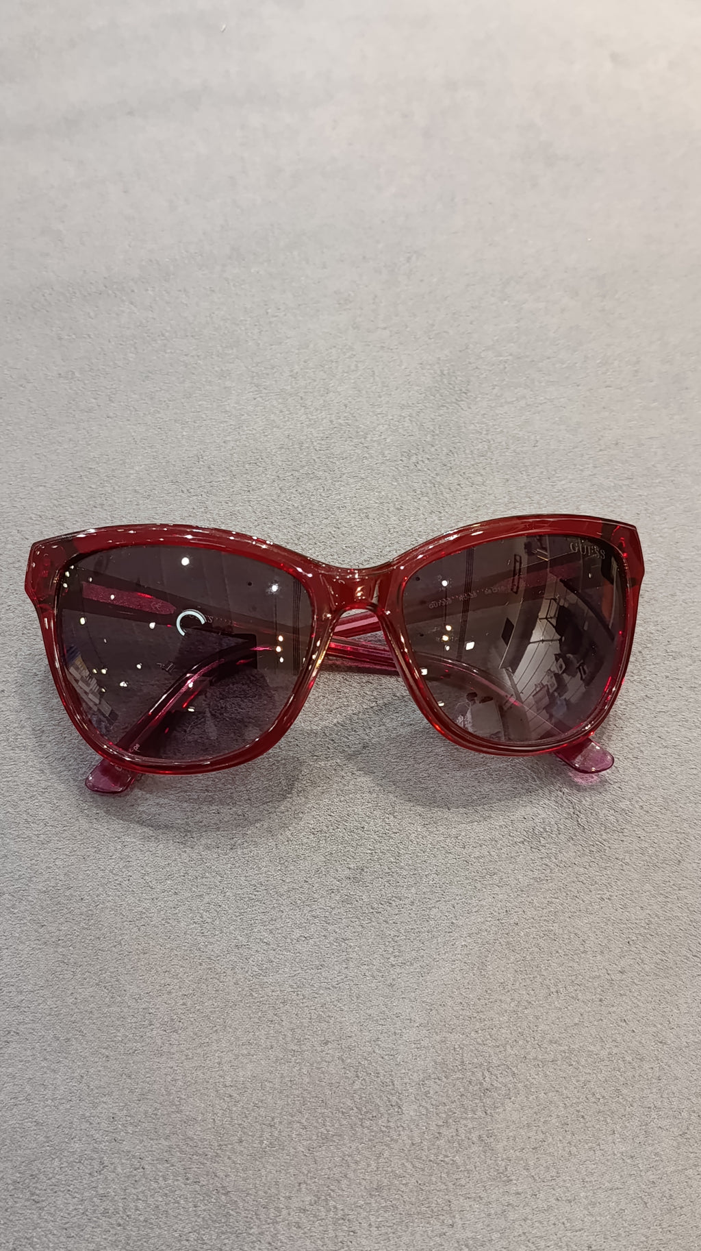 GUESS Women’s Translucent Red Cat-Eye Sunglasses