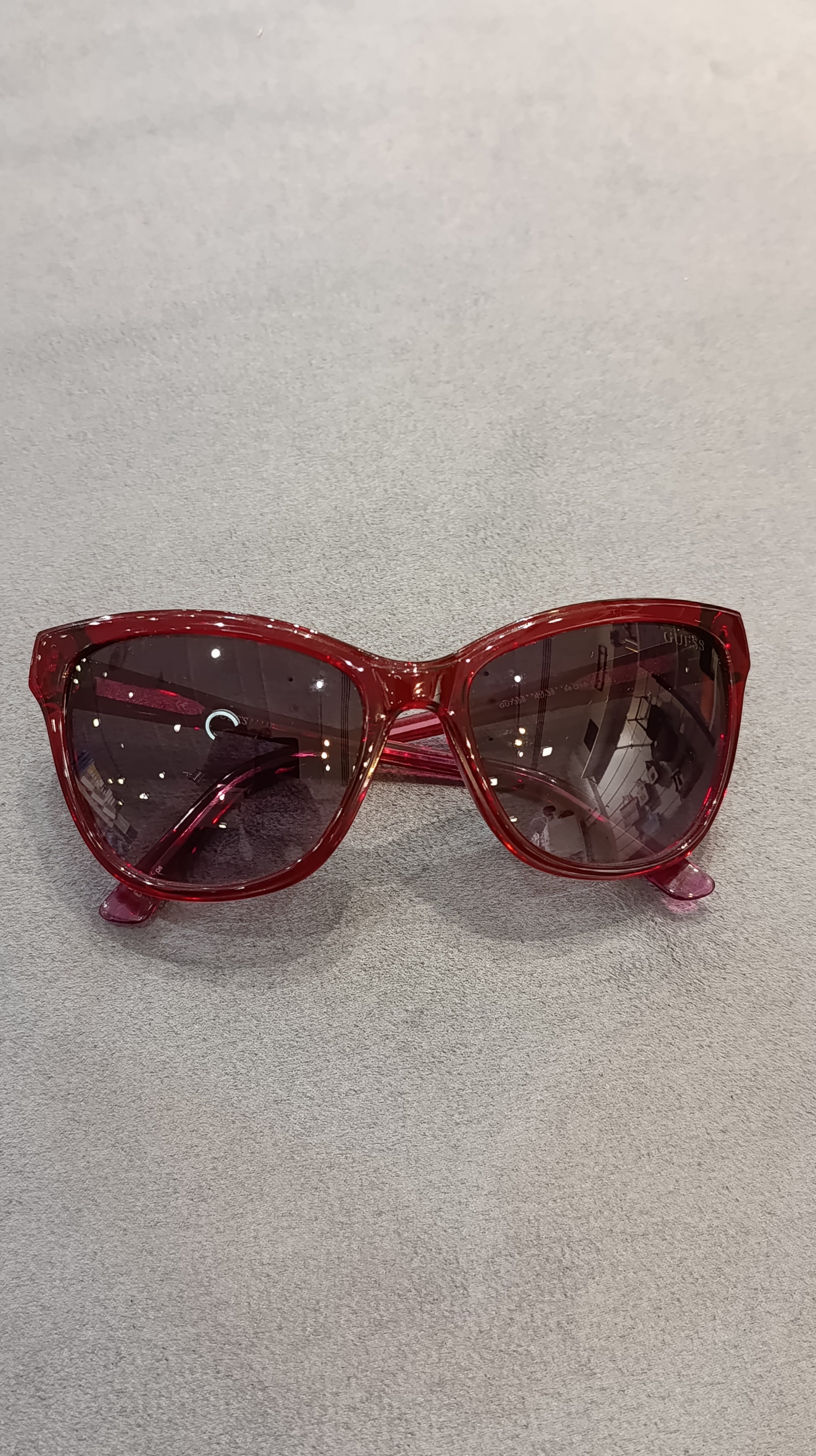 GUESS Women’s Translucent Red Cat-Eye Sunglasses