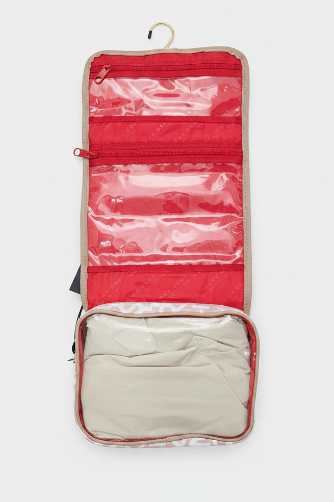 DKNY puffer roll cosmetic bag with a monogram print and tan -White light toffee