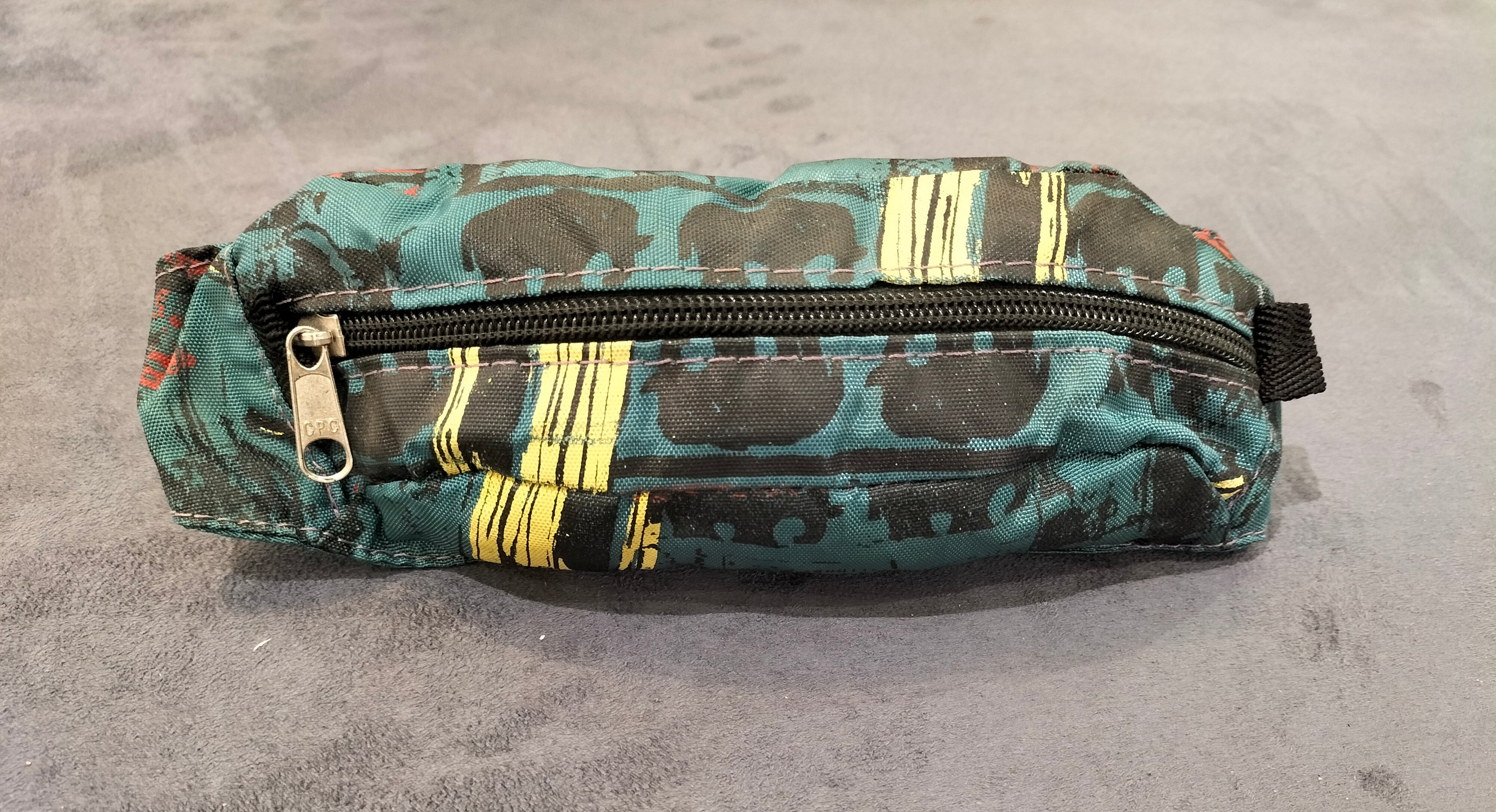 Teal Waist Pack with Black and Yellow Patterns
