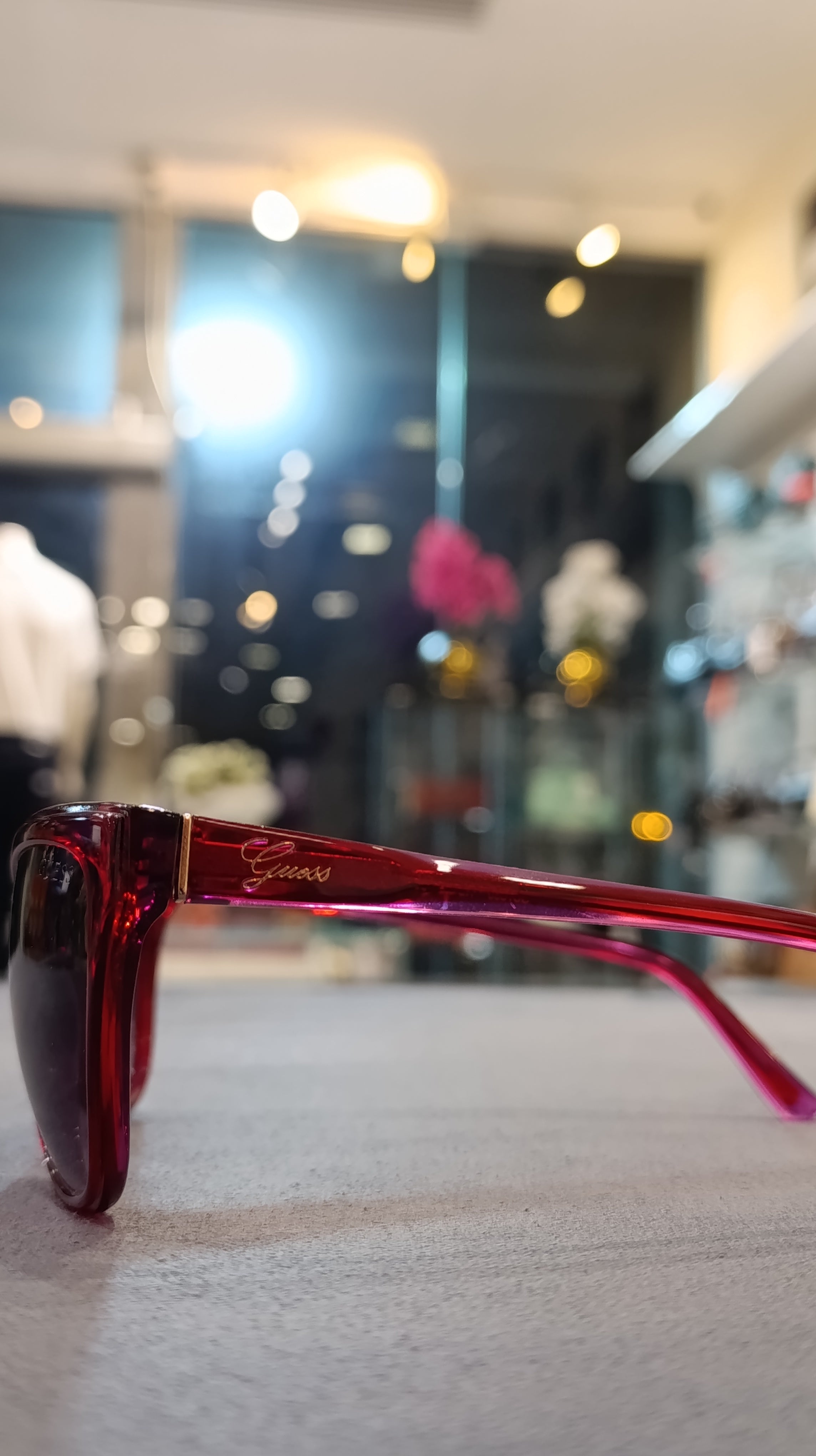 GUESS Women’s Translucent Red Cat-Eye Sunglasses