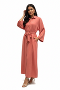 Woman wearing coral shirt dress