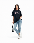 Woman wearing SMILE t-shirt