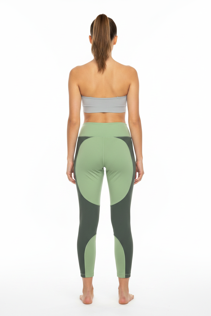 Woman wearing two-tone green leggings - Back