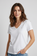 Woman wearing white v-neck tee
